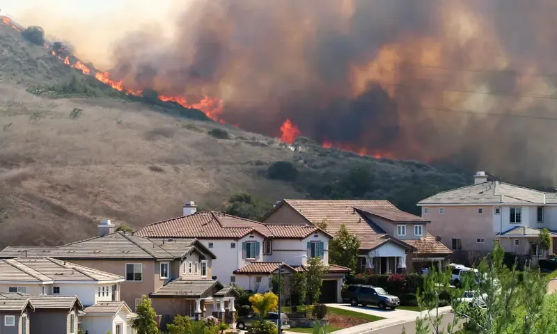 Wildfire raging near houses